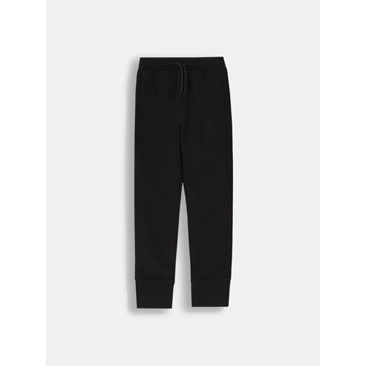 Coccodrillo Spodnie dresowe ZC4120201VGA Czarny Slim Fit ze sklepu MODIVO w kategorii Spodnie chłopięce - zdjęcie 182652780