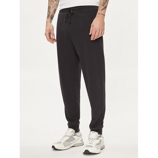 Gap Spodnie dresowe 868463-03 Czarny Regular Fit ze sklepu MODIVO w kategorii Spodnie męskie - zdjęcie 182653100
