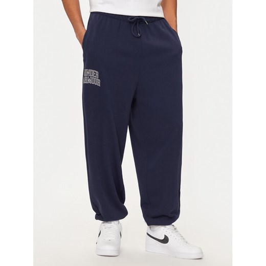 Under Armour Spodnie dresowe UA Icon 1386551 Granatowy Loose Fit ze sklepu MODIVO w kategorii Spodnie męskie - zdjęcie 182653112