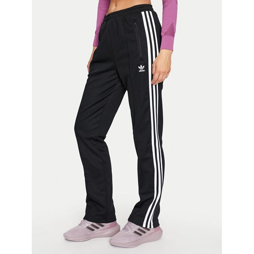 adidas Spodnie dresowe Beckenbauer IW3171 Czarny Regular Fit ze sklepu MODIVO w kategorii Spodnie damskie - zdjęcie 182653962