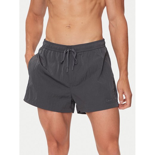 Calvin Klein Swimwear Szorty kąpielowe KM0KM01048 Szary Regular Fit ze sklepu MODIVO w kategorii Kąpielówki - zdjęcie 182653970