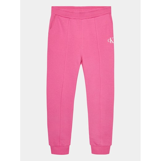 Calvin Klein Jeans Spodnie dresowe Logo IG0IG02285 Różowy Regular Fit ze sklepu MODIVO w kategorii Spodnie dziewczęce - zdjęcie 182655664