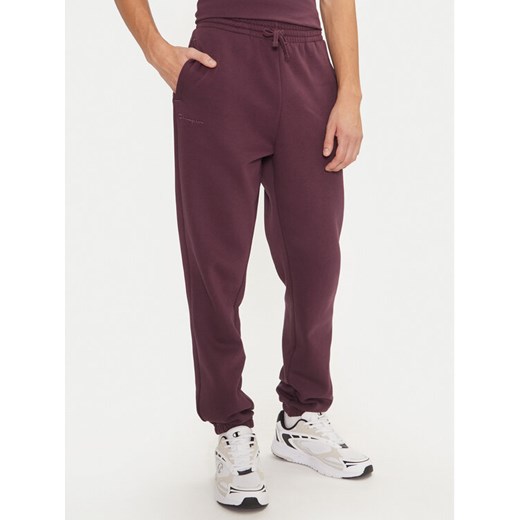 Champion Spodnie dresowe 220424 Fioletowy Regular Fit ze sklepu MODIVO w kategorii Spodnie męskie - zdjęcie 182656710