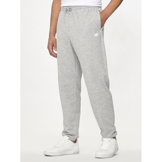 New Balance Spodnie dresowe Essentials MP41519 Szary Relaxed Fit ze sklepu MODIVO w kategorii Spodnie męskie - zdjęcie 182656741