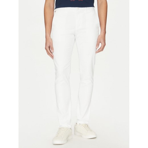 Tommy Hilfiger Chinosy Bleecker MW0MW26619 Biały Slim Fit ze sklepu MODIVO w kategorii Spodnie męskie - zdjęcie 182657431