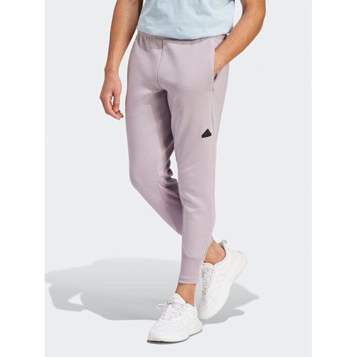 adidas Spodnie dresowe Z.N.E. Premium IR5214 Fioletowy Regular Fit ze sklepu MODIVO w kategorii Spodnie męskie - zdjęcie 182661491