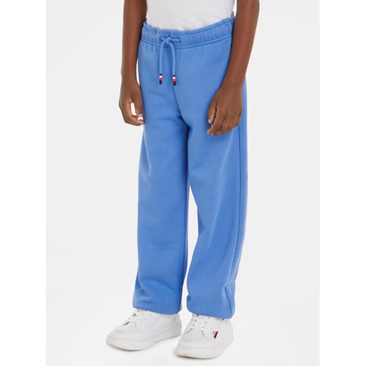 Tommy Hilfiger Spodnie dresowe Logo KB0KB08838 Niebieski Relaxed Fit ze sklepu MODIVO w kategorii Spodnie chłopięce - zdjęcie 182662191