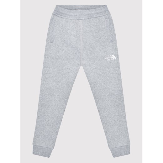 The North Face Spodnie dresowe NF0A2WAI Szary Regular Fit ze sklepu MODIVO w kategorii Spodnie chłopięce - zdjęcie 182662334
