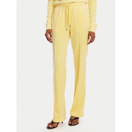 Juicy Couture Spodnie dresowe Tina JCAPW045 Żółty Regular Fit ze sklepu MODIVO w kategorii Spodnie damskie - zdjęcie 182662510