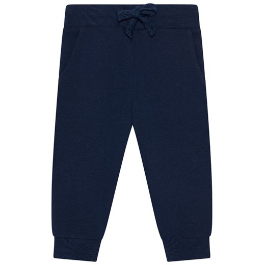 Guess Spodnie dresowe N93Q17 KAUG0 Granatowy Regular Fit ze sklepu MODIVO w kategorii Spodnie i półśpiochy - zdjęcie 182663540