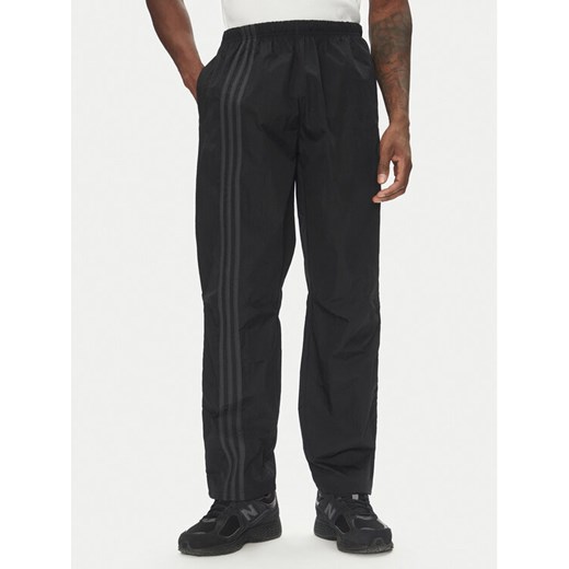 adidas Spodnie dresowe Fashion Side Mesh JD0051 Czarny Loose Fit ze sklepu MODIVO w kategorii Spodnie męskie - zdjęcie 182665161