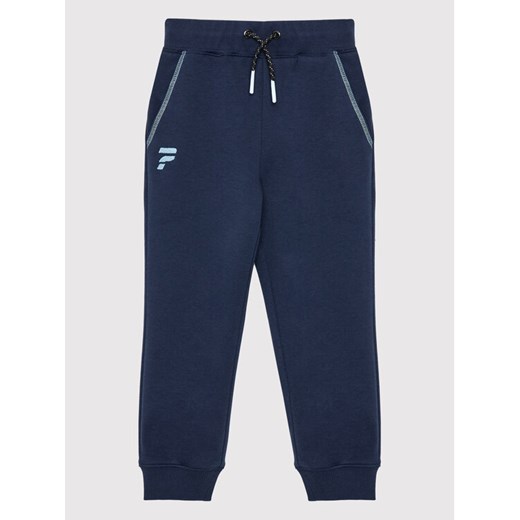 Guess Spodnie dresowe L2YQ15 KA3P1 Granatowy Regular Fit ze sklepu MODIVO w kategorii Spodnie chłopięce - zdjęcie 182665434