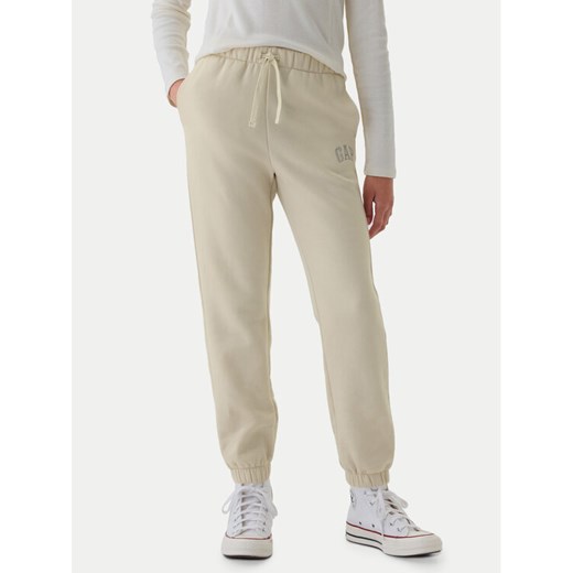 Gap Spodnie dresowe 486496-08 Beżowy Regular Fit ze sklepu MODIVO w kategorii Spodnie chłopięce - zdjęcie 182666402
