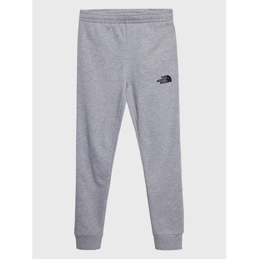 The North Face Spodnie dresowe Teen NF0A82EO Szary Regular Fit ze sklepu MODIVO w kategorii Spodnie chłopięce - zdjęcie 182668813