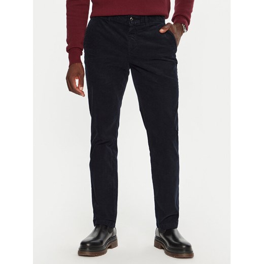Tommy Hilfiger Spodnie materiałowe MW0MW32932 Granatowy Regular Fit ze sklepu MODIVO w kategorii Spodnie męskie - zdjęcie 182669293