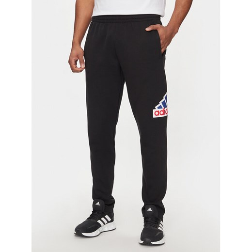 adidas Spodnie dresowe Future Icons Badge Of Sport IS3232 Czarny Regular Fit ze sklepu MODIVO w kategorii Spodnie męskie - zdjęcie 182670892