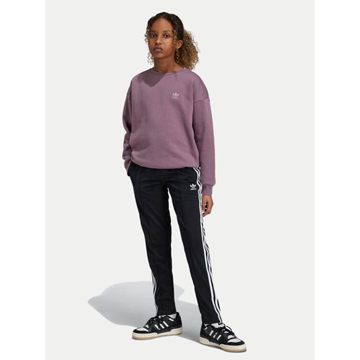 adidas Spodnie dresowe adicolor SST IY9793 Czarny Regular Fit ze sklepu MODIVO w kategorii Spodnie dziewczęce - zdjęcie 182671141