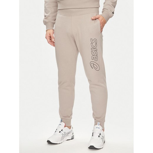Asics Spodnie dresowe Logo 2031E189 Szary Regular Fit ze sklepu MODIVO w kategorii Spodnie męskie - zdjęcie 182671891