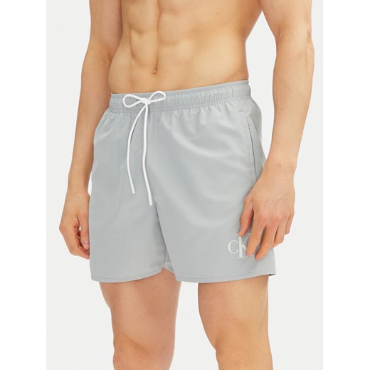Calvin Klein Swimwear Szorty kąpielowe KM0KM01101 Niebieski Regular Fit ze sklepu MODIVO w kategorii Kąpielówki - zdjęcie 182672143