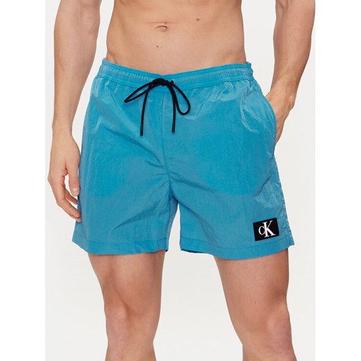 Calvin Klein Swimwear Szorty kąpielowe KM0KM00980 Niebieski Regular Fit ze sklepu MODIVO w kategorii Kąpielówki - zdjęcie 182672460