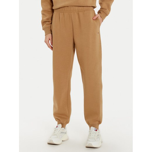 Tommy Hilfiger Spodnie dresowe Essential WW0WW45966 Beżowy Regular Fit ze sklepu MODIVO w kategorii Spodnie damskie - zdjęcie 182672872