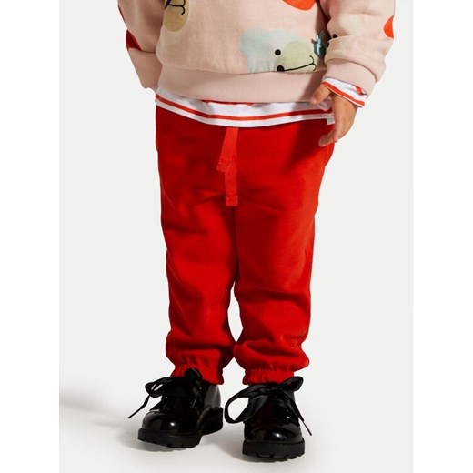 Coccodrillo Spodnie dresowe ZC4120101CGN Czerwony Regular Fit ze sklepu MODIVO w kategorii Spodnie i półśpiochy - zdjęcie 182672894
