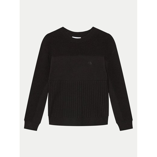 Calvin Klein Jeans Sweter Monogram IB0IB02156 Czarny Relaxed Fit ze sklepu MODIVO w kategorii Swetry dziewczęce - zdjęcie 182673912