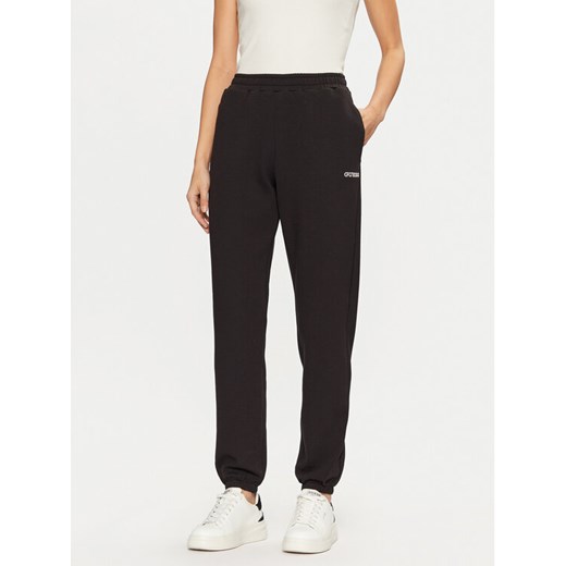 Guess Spodnie dresowe V5RB02 KCLD1 Brązowy Regular Fit ze sklepu MODIVO w kategorii Spodnie damskie - zdjęcie 182674523