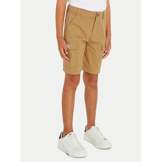 Tommy Hilfiger Szorty materiałowe KB0KB08799 Beżowy Straight Fit ze sklepu MODIVO w kategorii Spodenki chłopięce - zdjęcie 182679734