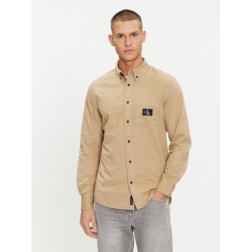 Calvin Klein Jeans Koszula J30J325772 Beżowy Regular Fit ze sklepu MODIVO w kategorii Koszule męskie - zdjęcie 182680843