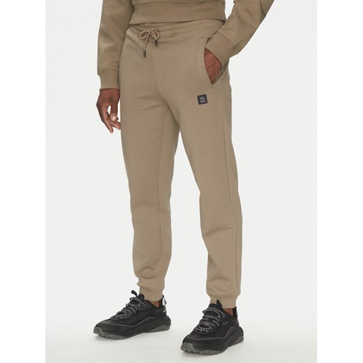 HUGO Spodnie dresowe Dimacs 50533695 Brązowy Relaxed Fit ze sklepu MODIVO w kategorii Spodnie męskie - zdjęcie 182681420