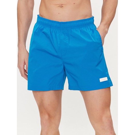 Calvin Klein Swimwear Szorty kąpielowe KM0KM00939 Niebieski Regular Fit ze sklepu MODIVO w kategorii Kąpielówki - zdjęcie 182681644
