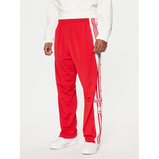 adidas Spodnie dresowe Adibreak JP3765 Czerwony Regular Fit ze sklepu MODIVO w kategorii Spodnie męskie - zdjęcie 182683341