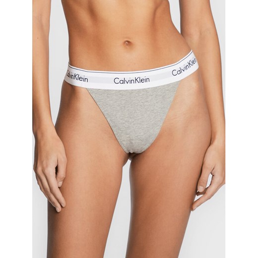 Calvin Klein Underwear Stringi 000QF7013E Szary ze sklepu MODIVO w kategorii Majtki damskie - zdjęcie 182683430