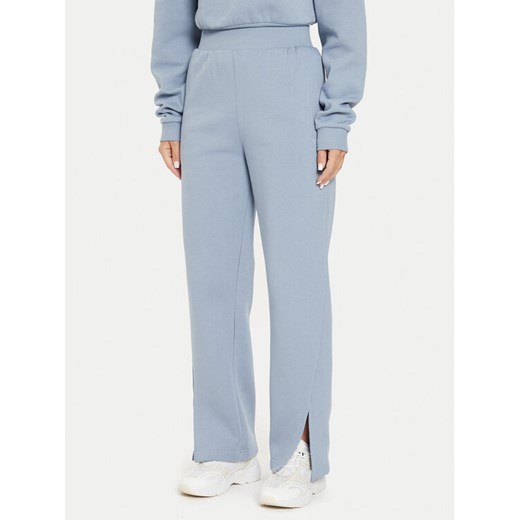 Reebok Spodnie dresowe Fleece Pant 100076053 Niebieski Regular Fit ze sklepu MODIVO w kategorii Spodnie damskie - zdjęcie 182684762