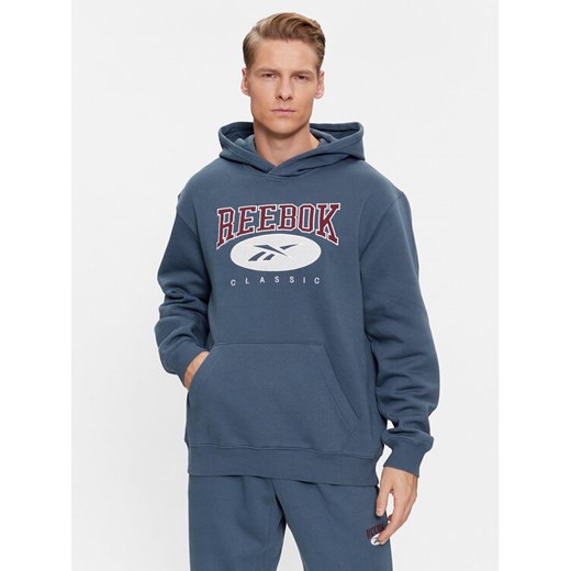 Reebok Bluza Archive Essentials IM1528 Niebieski Regular Fit ze sklepu MODIVO w kategorii Bluzy męskie - zdjęcie 182685700