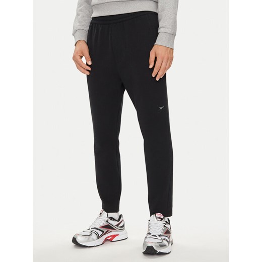 Reebok Spodnie dresowe Actic Coll Dreamblend 100075686 Czarny Regular Fit ze sklepu MODIVO w kategorii Spodnie męskie - zdjęcie 182685854