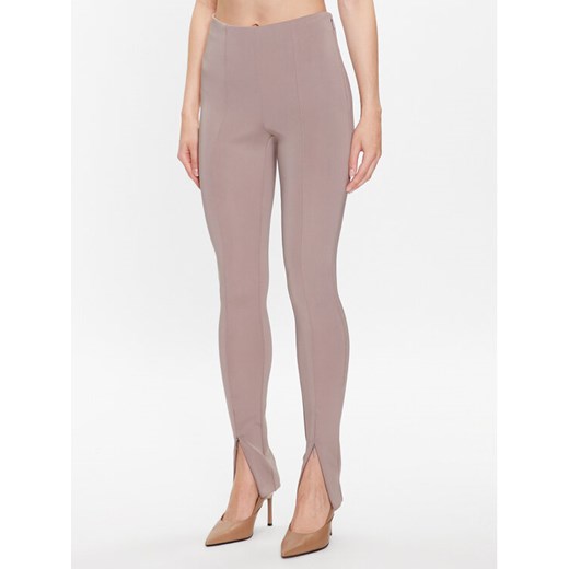 Calvin Klein Legginsy K20K205357 Beżowy Slim Fit ze sklepu MODIVO w kategorii Spodnie damskie - zdjęcie 182686080