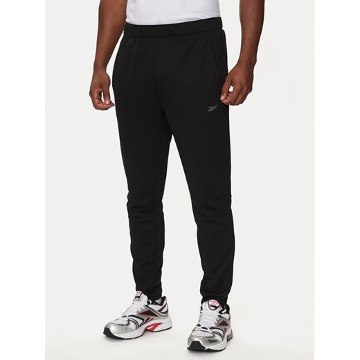 Reebok Spodnie dresowe 100070726 Czarny Regular Fit ze sklepu MODIVO w kategorii Spodnie męskie - zdjęcie 182687914