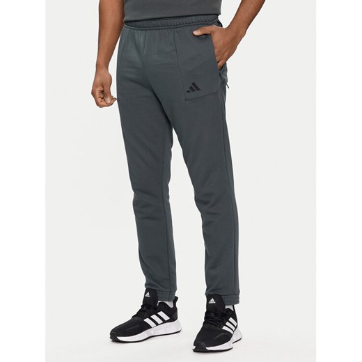 adidas Spodnie dresowe Pump Workout IT4311 Zielony Regular Fit ze sklepu MODIVO w kategorii Spodnie męskie - zdjęcie 182689080