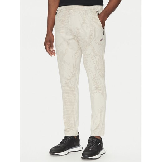 BOSS Spodnie dresowe Hicon Desert Active 50537761 Beżowy Slim Fit ze sklepu MODIVO w kategorii Spodnie męskie - zdjęcie 182692590
