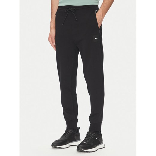 BOSS Spodnie dresowe Hadiko 50537198 Czarny Regular Fit ze sklepu MODIVO w kategorii Spodnie męskie - zdjęcie 182692744