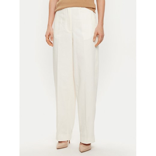 Tommy Hilfiger Spodnie materiałowe WW0WW43809 Écru Regular Fit ze sklepu MODIVO w kategorii Spodnie damskie - zdjęcie 182693122