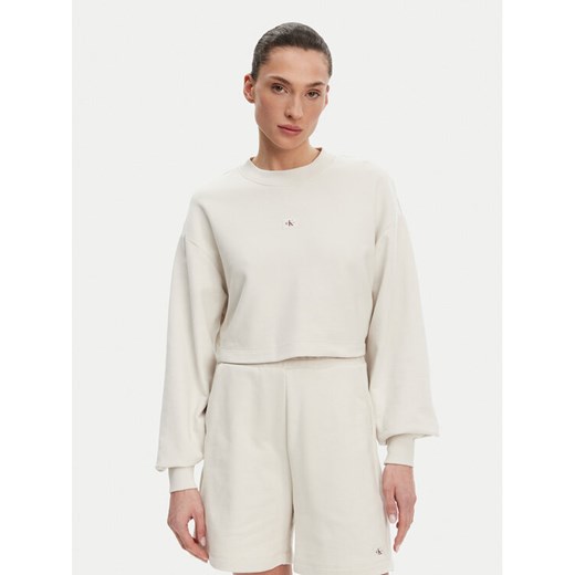 Calvin Klein Jeans Bluza J20J225370 Beżowy Regular Fit ze sklepu MODIVO w kategorii Bluzy damskie - zdjęcie 182693812