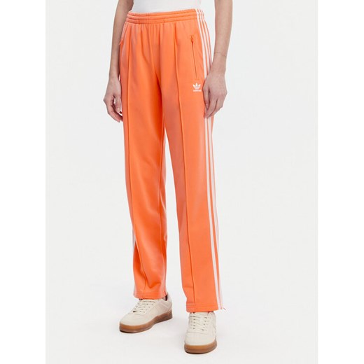 adidas Spodnie dresowe adicolor Classics Firebird JC8286 Pomarańczowy Regular Fit ze sklepu MODIVO w kategorii Spodnie damskie - zdjęcie 182694213