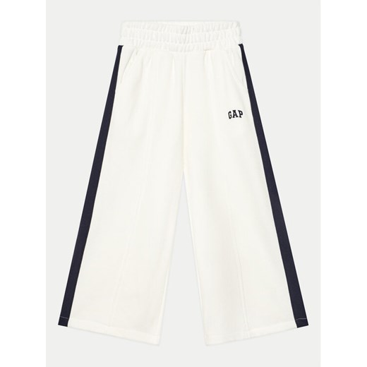 Gap Spodnie dresowe 745910-00 Biały Relaxed Fit ze sklepu MODIVO w kategorii Spodnie dziewczęce - zdjęcie 182695030