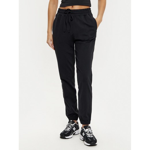 Girlfriend Collective Spodnie dresowe ReSet 6016 Czarny Slim Fit ze sklepu MODIVO w kategorii Spodnie damskie - zdjęcie 182695200