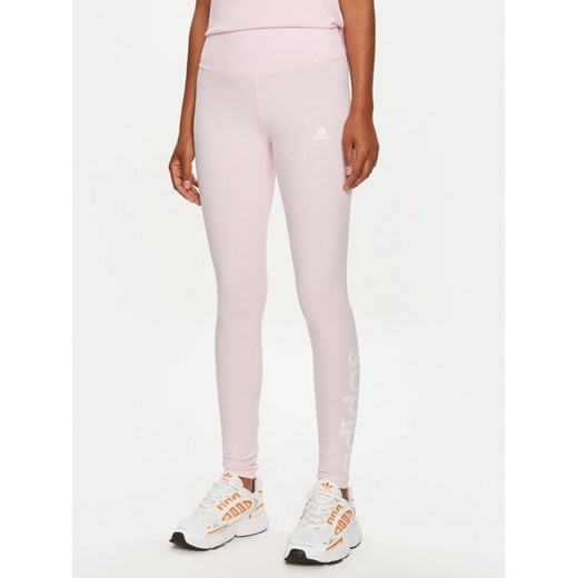 adidas Legginsy SPORT INSPIRED LOUNGEWEAR ESSENTIALS HIGH-WAISTED LOGO LEGGINGS ID0024 Różowy ze sklepu MODIVO w kategorii Spodnie damskie - zdjęcie 182696772