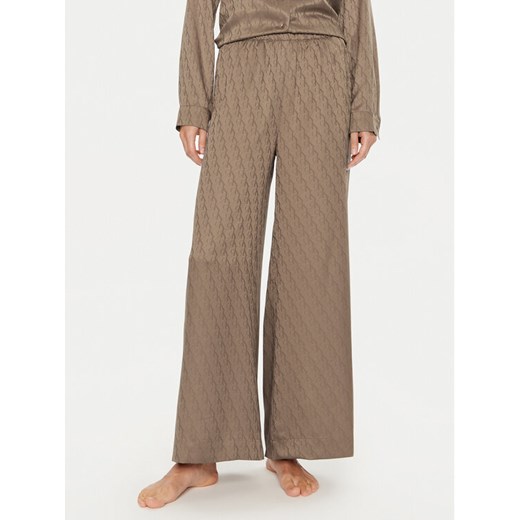 Calvin Klein Spodnie piżamowe 000QS7304E Brązowy Relaxed Fit ze sklepu MODIVO w kategorii Piżamy damskie - zdjęcie 182696950