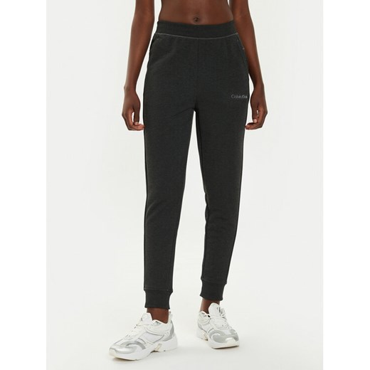 Calvin Klein Performance Spodnie dresowe 00GWS4P651 Czarny Relaxed Fit ze sklepu MODIVO w kategorii Spodnie damskie - zdjęcie 182699893